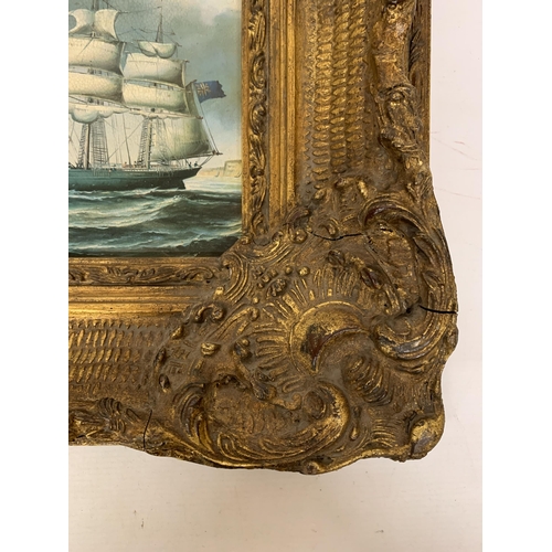 81 - A VINTAGE PRINT ON BOARD OF A CLIPPER/SAILING SHIP IN FULL SAIL IN A HIGHLY ORNATE GILDED FRAME - FR... 