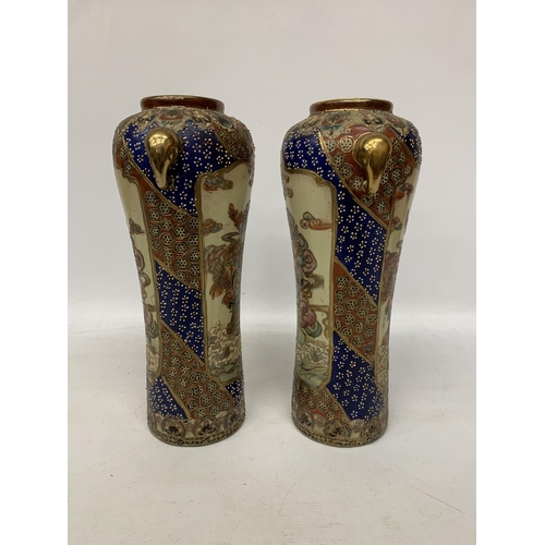 83 - A PAIR OF LARGE JAPANESE SATSUMA VASES WITH GEISHA DETAIL AND ELEPHANT HANDLES