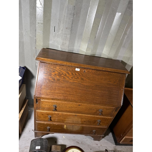 3525 - AN OAK BUREAU WITH FITTED INTERIOR AND THREE LOWER DRAWERS