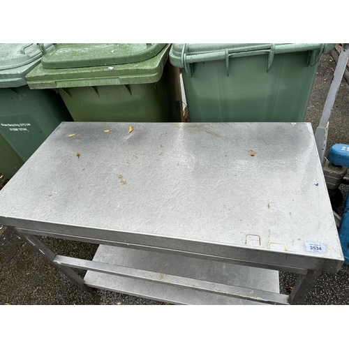 3534 - A SMALL LOW STAINLESS STEEL KITCHEN WORK BENCH WITH LOWER SHELF