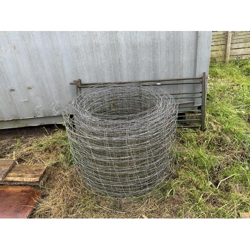 3550 - TWO METAL SHEEP HURDLES AND A ROLL OF SHEEP WIRE