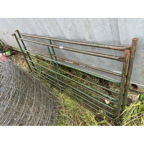 3550 - TWO METAL SHEEP HURDLES AND A ROLL OF SHEEP WIRE