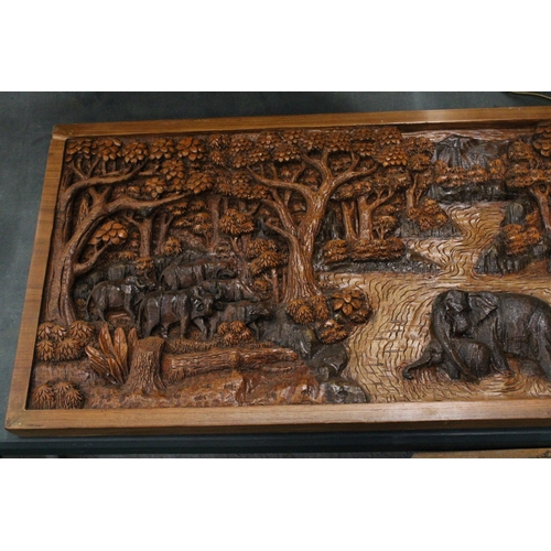 78 - A CARVED BALINESE WOODEN PANEL WITH THREE DIMENSIONAL WORK OF ART - APPROX 142 X 49 CM