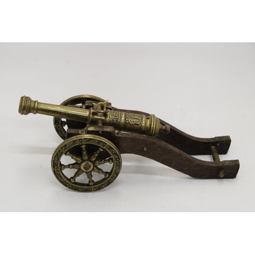 207 - A WOOD AND BRASS CANNON