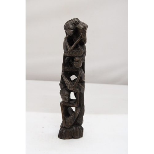 252 - AN AFRICAN HAND CARVED TREE OF LIFE FIGURE, HEIGHT 29CM