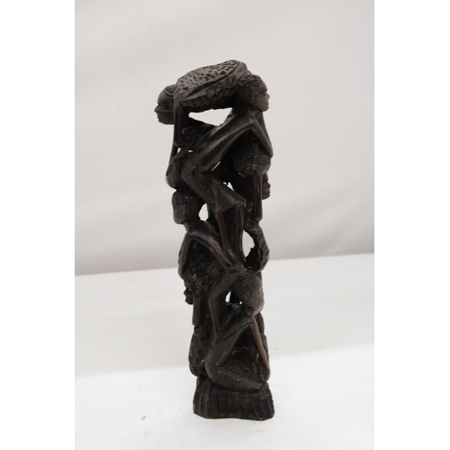 252 - AN AFRICAN HAND CARVED TREE OF LIFE FIGURE, HEIGHT 29CM