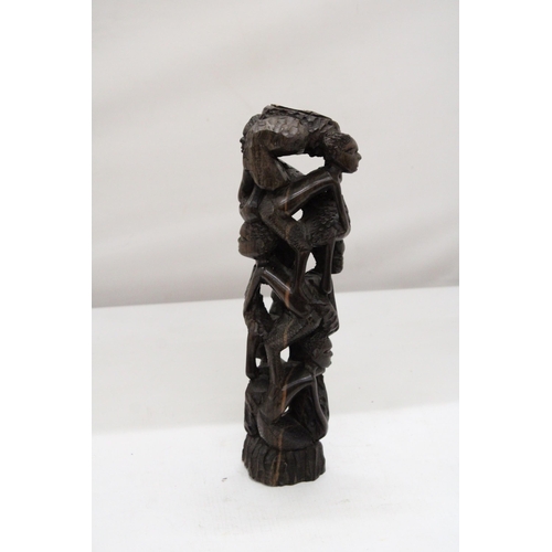 252 - AN AFRICAN HAND CARVED TREE OF LIFE FIGURE, HEIGHT 29CM