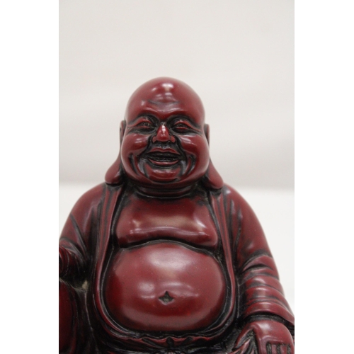 253 - A FIGURE OF A LAUGHING RED BUDDAH