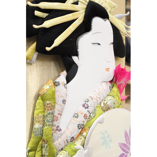 286 - A VINTAGE JAPANESE HAGOITA GEISHA DOLL WITH A SILK PADDLE ON A WOODEN STAND, HEIGHT 75CM