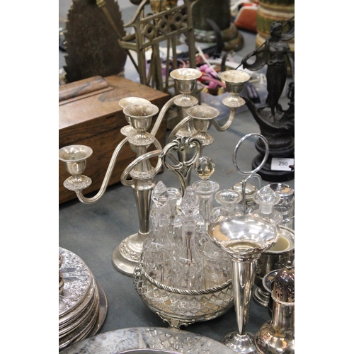 291 - A LARGE QUANTITY OF SILVER PLATED ITEMS TO INCLUDE TRAYS, CANDLEABRAS, TWO CONDIMENT SETS WITH GLASS... 