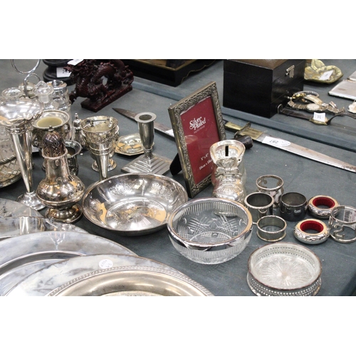 291 - A LARGE QUANTITY OF SILVER PLATED ITEMS TO INCLUDE TRAYS, CANDLEABRAS, TWO CONDIMENT SETS WITH GLASS... 