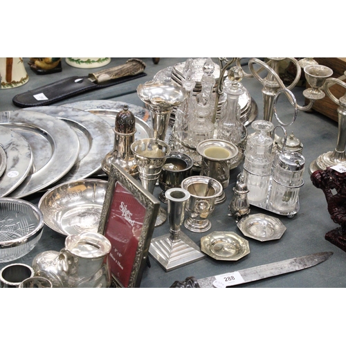 291 - A LARGE QUANTITY OF SILVER PLATED ITEMS TO INCLUDE TRAYS, CANDLEABRAS, TWO CONDIMENT SETS WITH GLASS... 