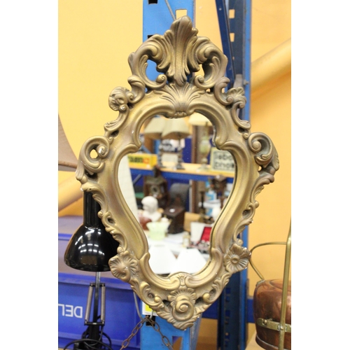 357 - AN ORNATE GILT FRAMED MIRROR