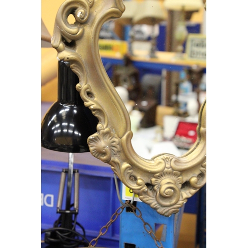 357 - AN ORNATE GILT FRAMED MIRROR