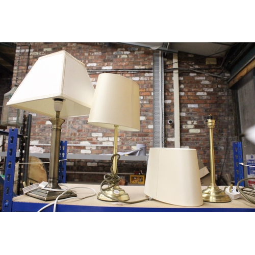 390 - THREE BRASS STYLE TABLE LAMPS ONE WITH A COLUMN BASE, ALL WITH SHADES