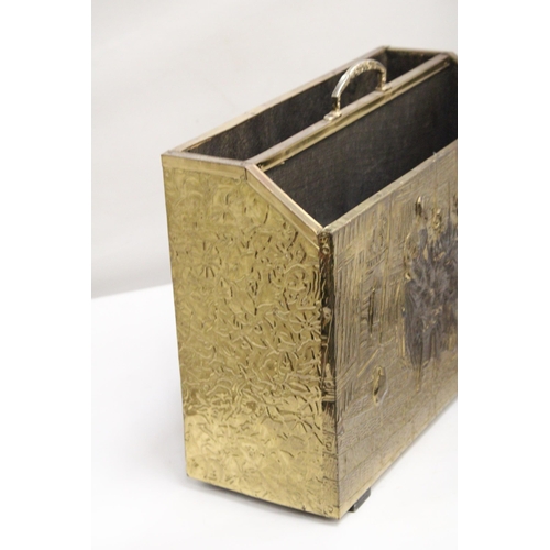 396 - A VINTAGE BRASS MAGAZINE RACK