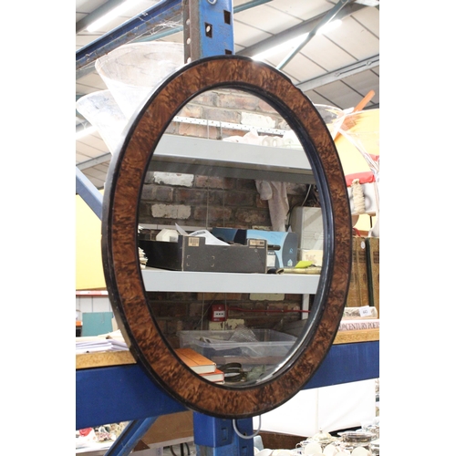 442 - A VINTAGE OVAL MIRROR