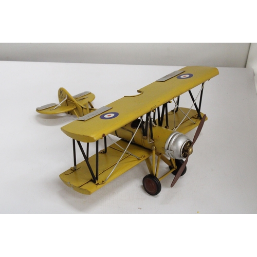 461 - A YELLOW TIN PLATE BI-PLANE