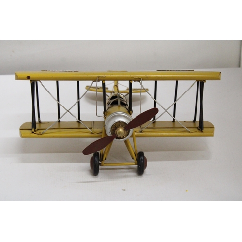 461 - A YELLOW TIN PLATE BI-PLANE