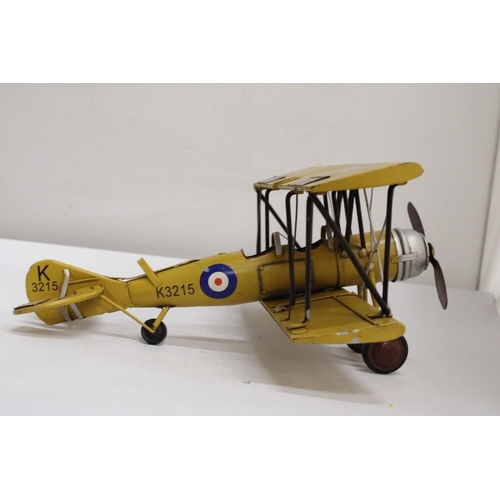 461 - A YELLOW TIN PLATE BI-PLANE