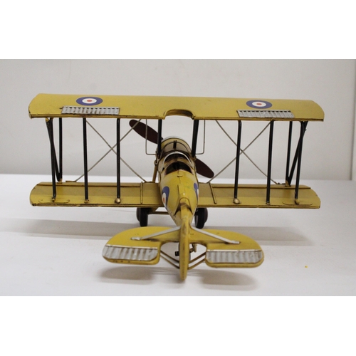 461 - A YELLOW TIN PLATE BI-PLANE