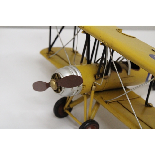 461 - A YELLOW TIN PLATE BI-PLANE