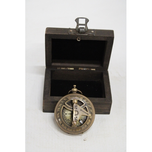 469 - A BOXED BRASS SUNDIAL AND COMPASS