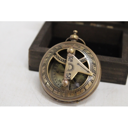 469 - A BOXED BRASS SUNDIAL AND COMPASS