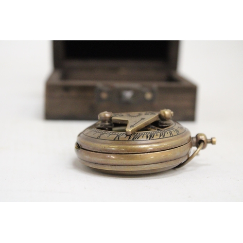 469 - A BOXED BRASS SUNDIAL AND COMPASS