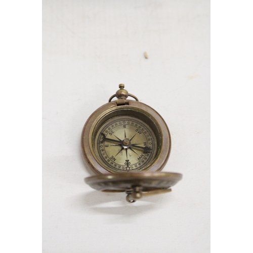 469 - A BOXED BRASS SUNDIAL AND COMPASS