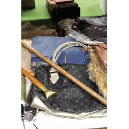 914 - A LARGE QUANTITY OF ITEMS TO INCLUDE UMBRELLAS, HANDBAGS, SATCHELS, A WALKING STICK ETC