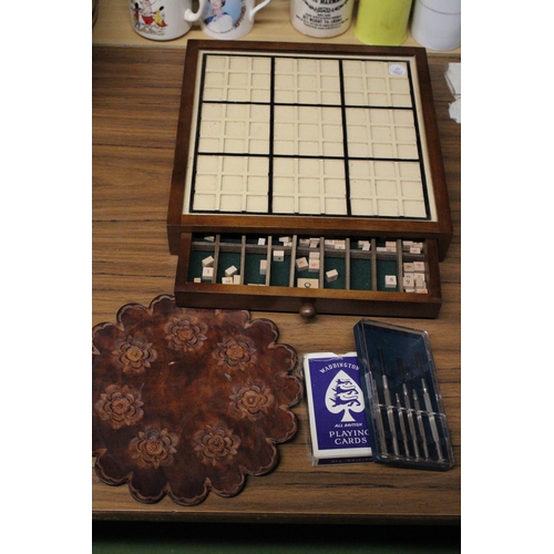 998 - A WOODEN SUDOKU GAME WITH DRAWER AND NUMBERS PLAYING CARDS, DARTS, ETC.