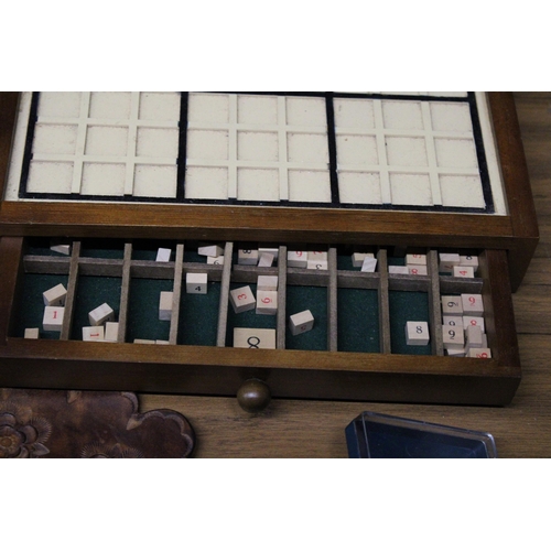 998 - A WOODEN SUDOKU GAME WITH DRAWER AND NUMBERS PLAYING CARDS, DARTS, ETC.