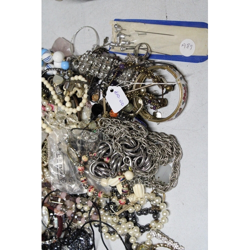 1045 - A LARGE QUANTITY OF COSTUME JEWELLERY TO INCLUDE BEADS, BANGLES, BROOCHES, EARRINGS, ETC.,