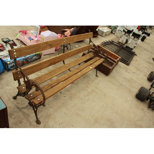 1928 - A  WOODEN SLATTED GARDEN BENCH WITH VICTORIAN BLACKBERRY AND VINE CAST BENCH ENDS