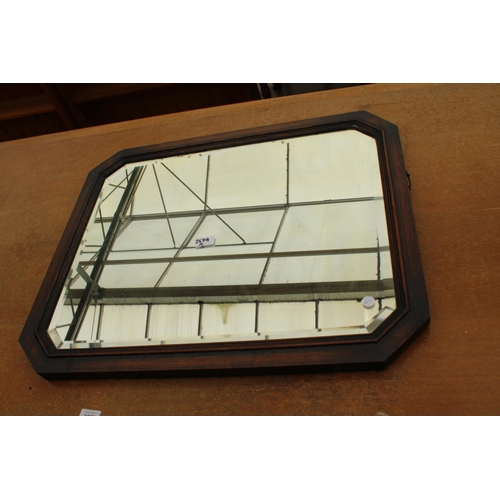 2579A - AN EARLY 20TH CENTURY OAK BEVEL EDGE MIRROR WITH CANTED CORNERS 28