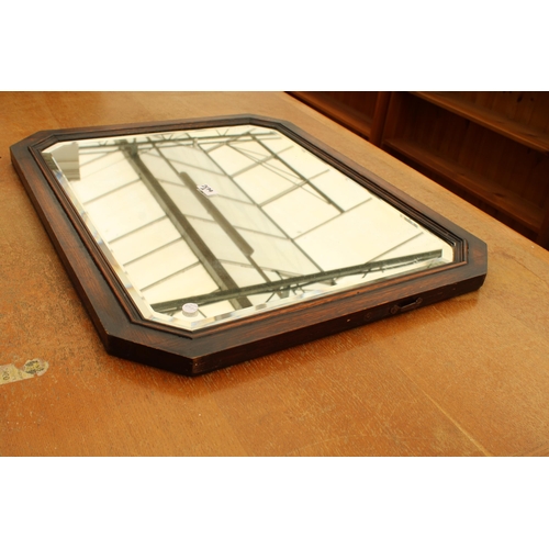 2579A - AN EARLY 20TH CENTURY OAK BEVEL EDGE MIRROR WITH CANTED CORNERS 28