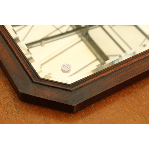 2579A - AN EARLY 20TH CENTURY OAK BEVEL EDGE MIRROR WITH CANTED CORNERS 28