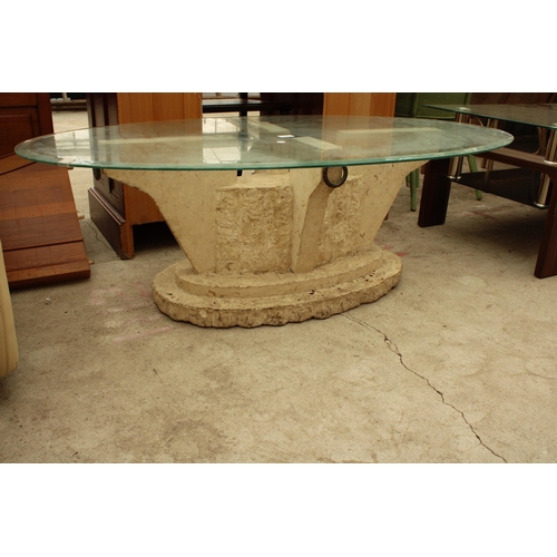 2620 - AN OVAL GLASS COFFEE TABLE ON A STONE EFFECT BASE 51