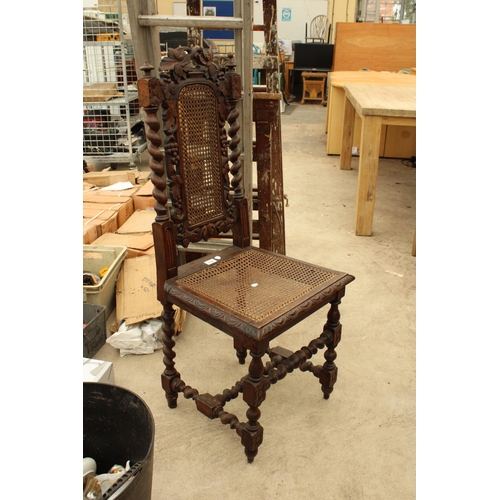 2724 - AN OAK JACOBEAN STYLE HALL CHAIR WITH CANE SEAT AND BACK, BARLEY TWIST LEGS, UPRIGHTS AND STRETCHERS