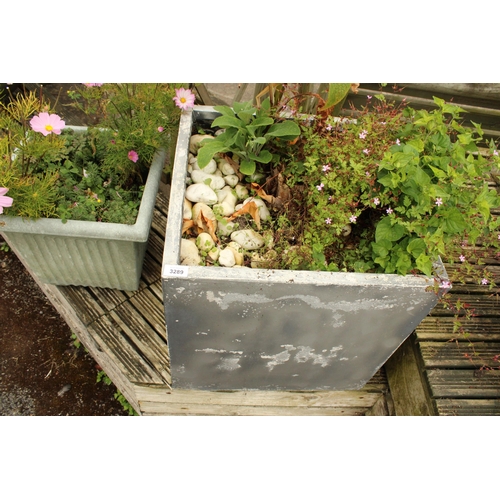 3289 - A LARGE CEMENT FIBRE PLANTER AND A FURTHER PLASTIC TUB BOTH CONTAINING PLANTS