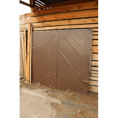 3315 - A LARGE FOLDING GARAGE DOOR AND FRAME