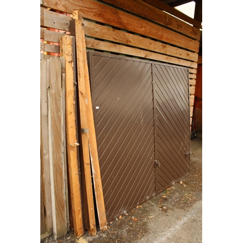 3315 - A LARGE FOLDING GARAGE DOOR AND FRAME