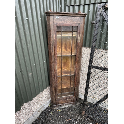 3553 - AN OAK GLAZED CORNER CUPBOARD WITH H BRASS HINGES