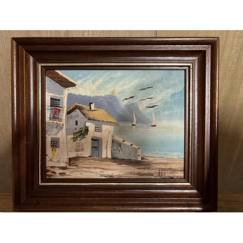 82 - A FRAMED OIL ON CANVAS OF A MEDITERRANEAN HOUSE, BOAT AND BEACH SCENE SIGNED TO LOWER RIGHT HAND COR... 