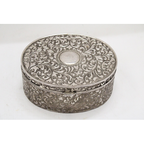 221 - A LARGE VINTAGE SILVER PLATED OVAL REPOUSSE JEWELLERY CASKET