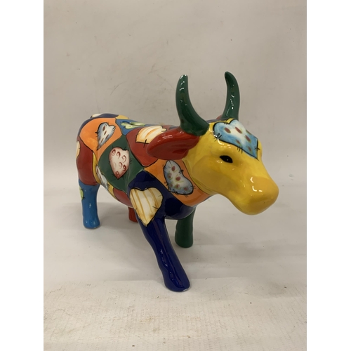 110 - A HANDPAINTED CERAMIC MONEY BOX COW