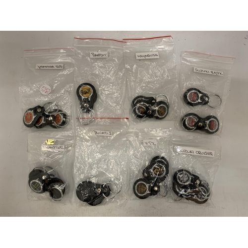 140 - A COLLECTION OF MOTORCYCLE KEY RINGS TO INCLUDE SUZUKI CRUISER, BANDIT, MONSTER, DUCATI 2, ETC.,