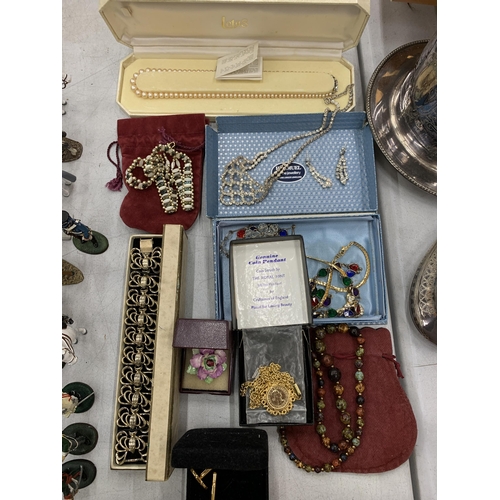 146 - A LARGE QUANTITY OF COSTUME JEWELLERY TO INCLUDE CUFFLINKS, EARRINGS, NECKLACES, ETC., TO INCLUDE A ... 