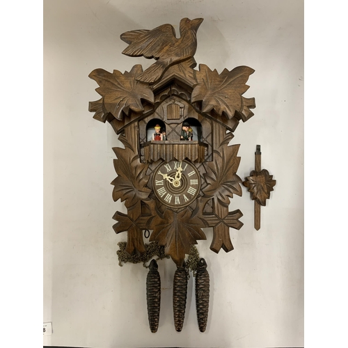 158 - A VINTAGE BLACK FOREST SWISS MADE BY REUGE ROMANCE CUCKOO CLOCK